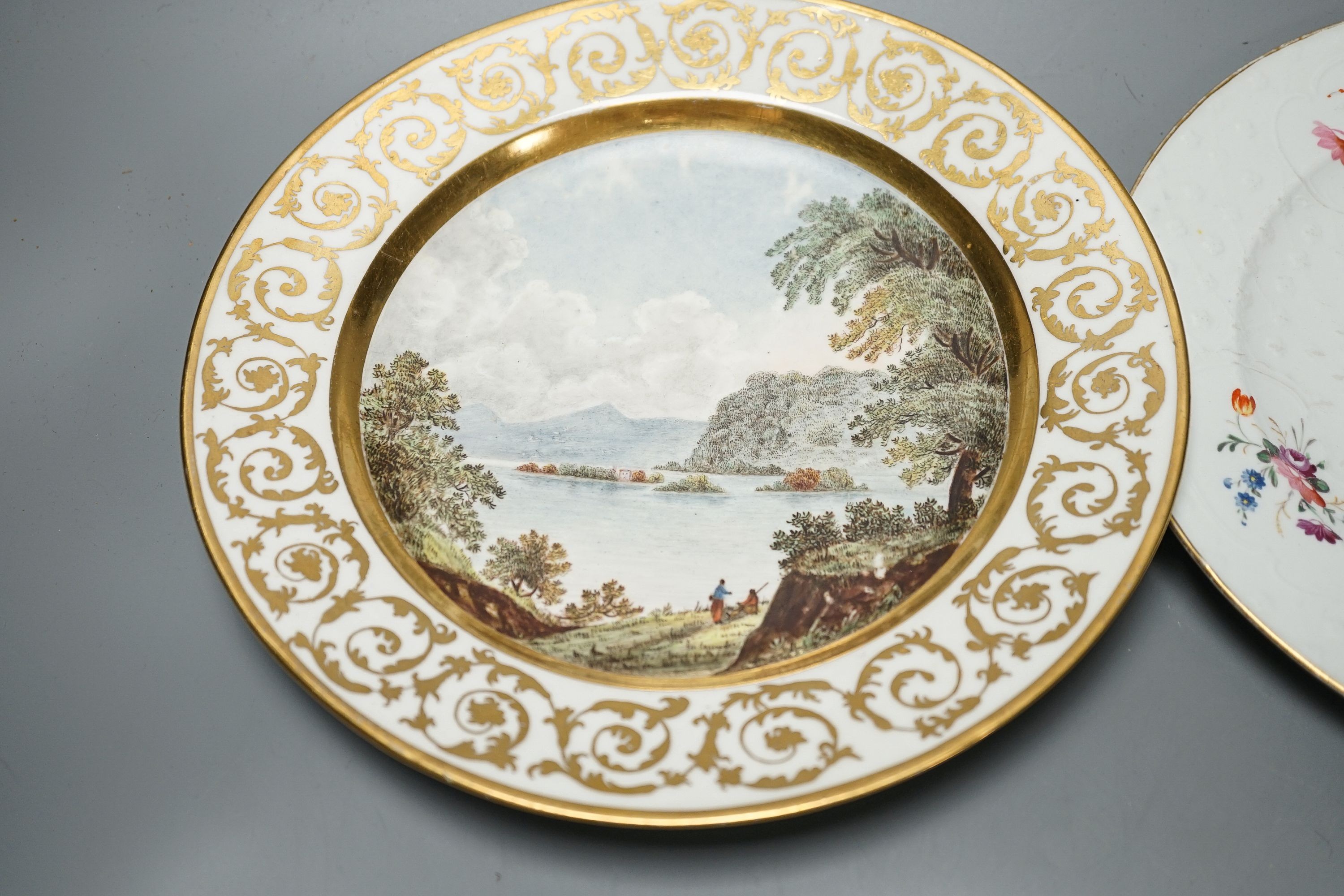 18th/19th century cabinet plates - A rare early Coalport landscape dessert plate, c.1805-10, a Coalport style plate, a Worcester blue and gilt foliate dish, c. 1790 and a pair of Royal Worcester dishes (5)